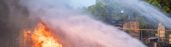 Firefighters Extinguishing Blaze in Industrial Area