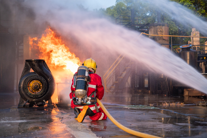 Firefighters Extinguishing Blaze in Industrial Area