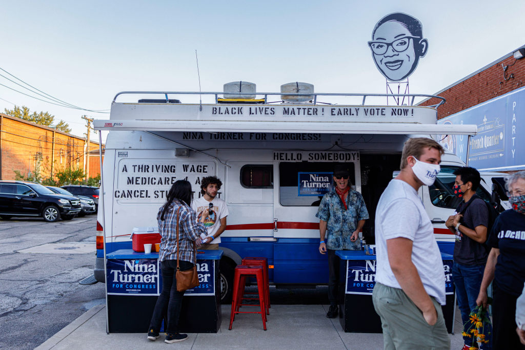 A campaign vehicle for Nina Turner is setup at the entrance...
