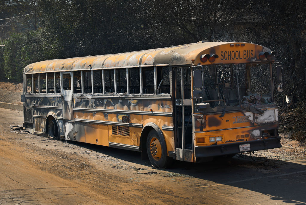 The Eaton fire burned out this school bus parked outside the burned down Aveson Charter School in Altadena...