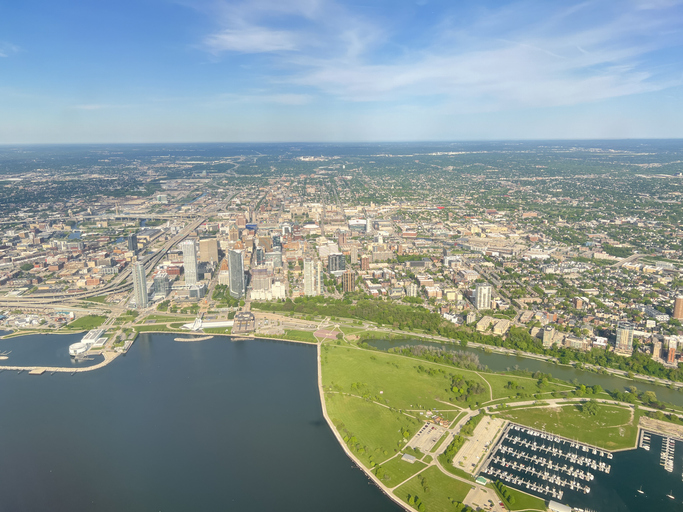 Aerial shot. Downtown Milwaukee buildings and yacht harbor