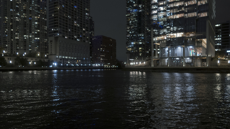 Group of Tall Office Buildings over Canal in Dark Urban Cityscape